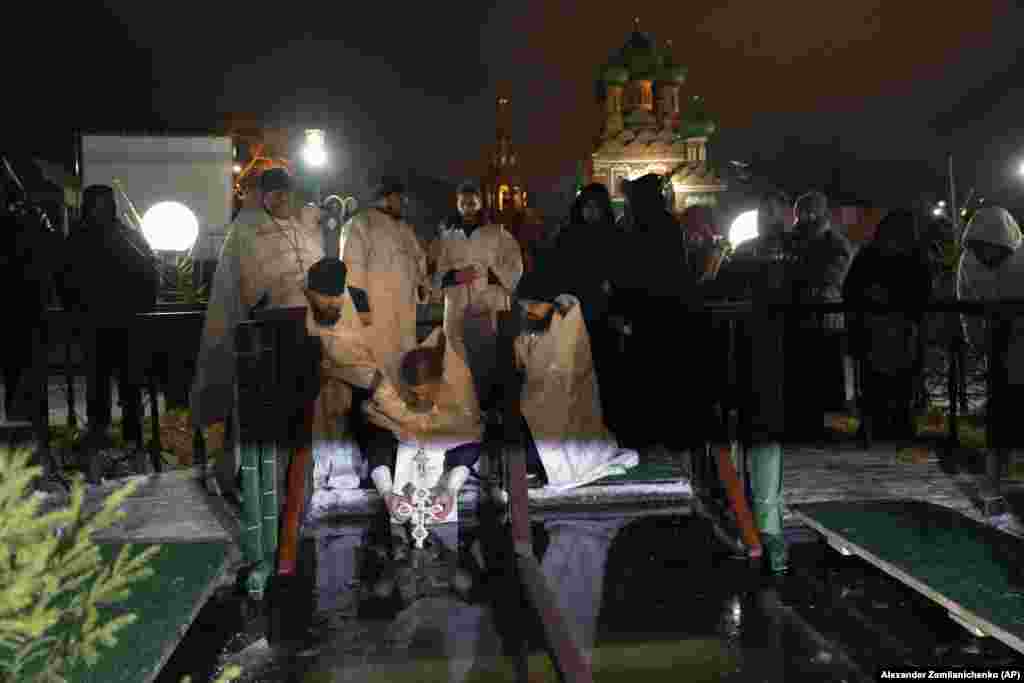 Priests blessed the icy water at the Church of the Holy Trinity in Moscow, Russia, late on January 18. With around 90 million members, the Russian Orthodox Church traditionally carries out the blessing of the waters twice: on the eve of the Epiphany and again on the holiday itself on January 19. &nbsp;