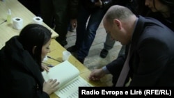 Voters prepare to cast ballots in the municipal elections at a polling station in the ethnically divided city of Kosovska Mitrovica on November 17.