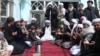 Sufi leader Abdul Waheed Bahaduri (center) prays in a mosque in Kabul.