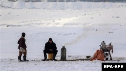 A tea-seller braves the cold amid freezing temperatures in Kabul. 