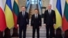 Polish President Andrzej Duda (left), Ukrainian President Volodymyr Zelenskiy (center), and Lithuanian President Gitanas Nauseda at a meeting in the Ukrainian village of Huta on December 20.