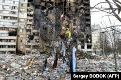 An apartment building damaged by shelling in Kharkiv