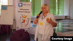 Harant principal Svitlana Borovkova at the now-ruined school building in Lysychansk