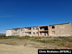 With no central heating, residents of Bestobe have bricked up abandoned apartments to prevent drafts in apartments that are still occupied.