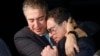 Siamak Namazi (right) is embraced by a relative upon returning to the United States last year after being imprisoned in Iran for eight years. 