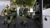 Recruits take a bus near a military recruitment center in Krasnodar, Russia. Human rights defenders say they have been inundated with pleas for help from thousands of migrants who have mistakenly enrolled in the Russian Army or been pressured to do so.