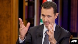 Syrian President Bashar al-Assad speaking during a September 23 interview in Damascus.