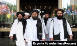 Members of a Taliban delegation leave after peace talks with Afghan senior politicians in Moscow in May.