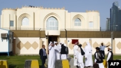 Guests arrive for the opening ceremony of the new Taliban political office in Doha on June 18.