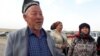 People prepare to cross the Gulbahor border area in southern Tajikistan on March 7.