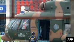 A number of sporting events have been canceled in Pakistan since the Sri Lanka cricket team's bus was ambushed by these unidentified gunmen in Lahore one year ago. Here, a Sri Lankan player is being evacuated by Pakistan military helicopter from Gaddafi S