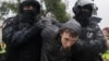 Russian police detain a protester during a rally against the mobilization of reservists ordered by President Vladimir Putin in Moscow on September 24.