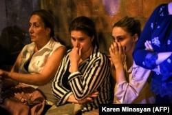 Relatives of wounded Armenian soldiers gather outside a military hospital in Yerevan on September 13.