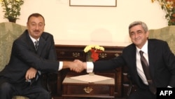 Armenian President Serzh Sarkisian (right) met with his Azerbaijani counterpart Ilham Aliyev in Moldova last month.