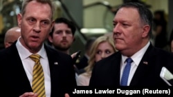 Acting U.S. Defense Secretary Patrick Shanahan (left) and Secretary of State Mike Pompeo have blamed Iran for the attacks on oil tankers.