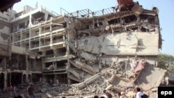 A large section of the Pearl Continental Hotel is in ruins after a suspected suicide bomb blast.