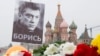 A portrait of Boris Nemtsov stands at an impromptu shrine to the Russian opposition leader on the bridge where he was shot dead in 2015. (file photo) 