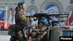 Female soldiers from an army reconnaissance unit take part in a military parade in Yerevan.