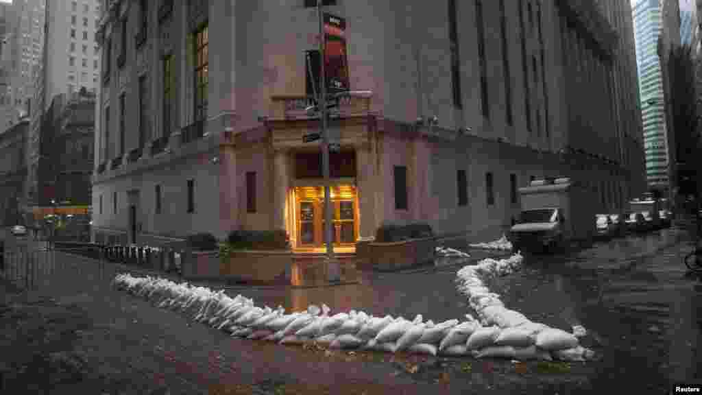 Sandbags block the entrance of the New York Stock Exchange in downtown Manhattan as Hurricane Sandy draws near the city.&nbsp;