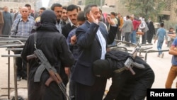 Fighters from the Islamist Syrian rebel group Jabhat al-Nusra search civilians in Aleppo. (file photo)