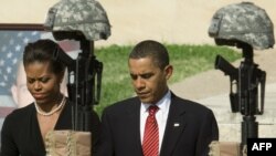 U.S. President Obama Barack Obama and his wife, Michelle, take part in the memorial at Fort Hood.