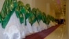 Brides stand inside a wedding hall as they wait for the start of a mass marriage ceremony in Kabul in June.