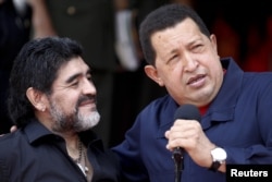 Venezuela's President Hugo Chavez welcomes Maradona in Caracas in 2010.