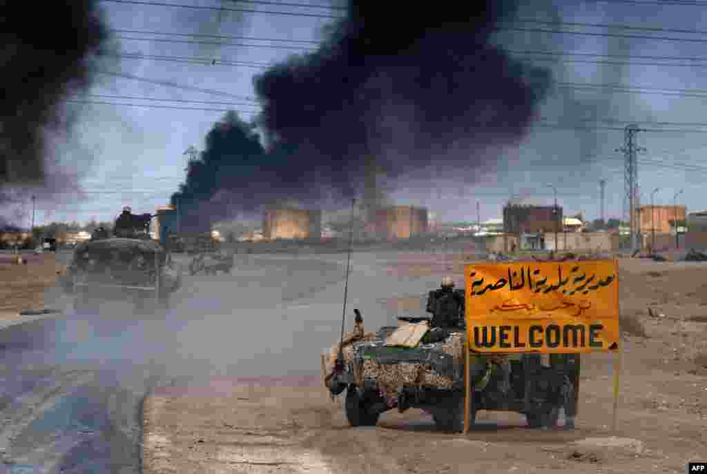 U.S. Marines enter the southern city of Al-Nasiriyah on March 23.