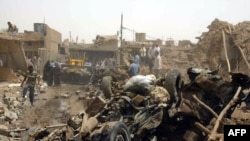 Men search through the wreckage in Kirkuk.