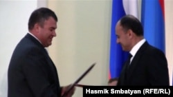 The Russian and Armenian defense ministers, Anatoly Serdyukov (left) and Seyran Ohanian, were at a signing ceremony for the deal in Yerevan in August.