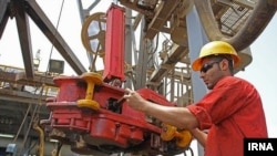 Iran -- An Iranian worker on oil field in south of Iran