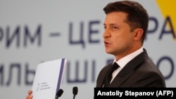 Ukrainian President Volodymyr Zelenskiy talks to reporters at the Crimean Platform summit in Kyiv on August 23. 