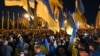 People take part in a protest against the approval of the so-called Steinmeier Formula in front of the president's office in Kyiv on October 2.