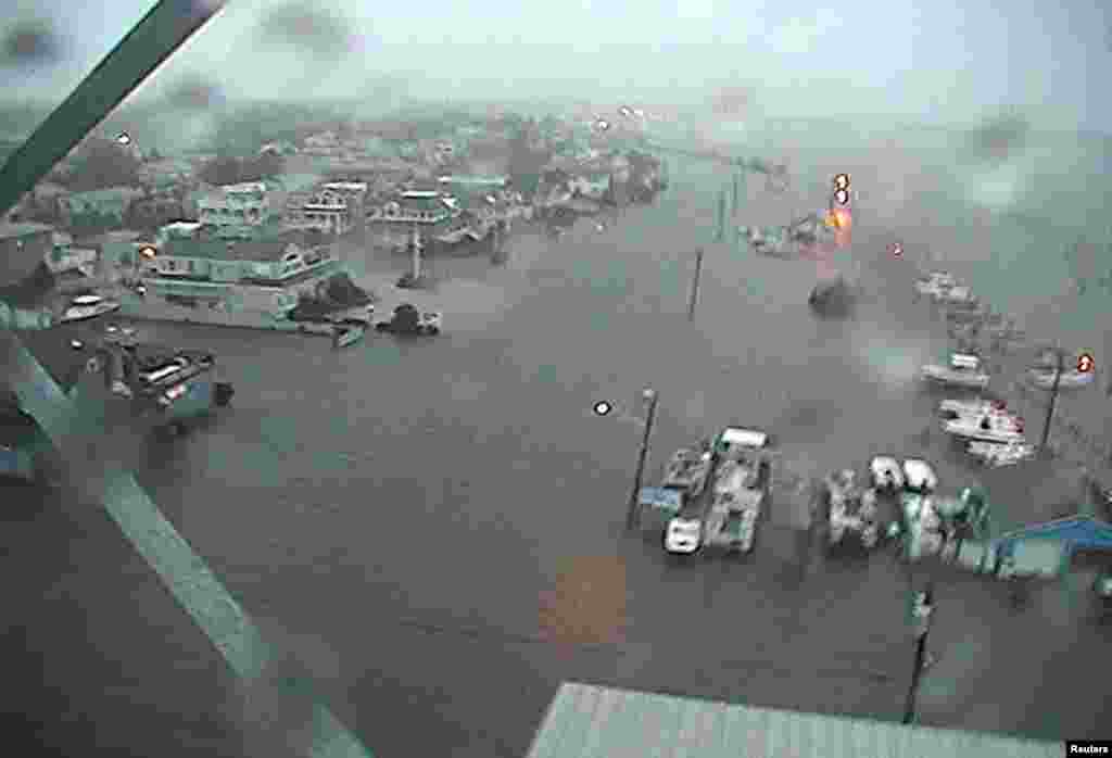 U.S.Coast Guard Station Barnegat Light, New Jersey, and the surrounding area is shown flooded in this handout photo supplied by the U.S. Coast Guard as Hurricane Sandy moves into the area.