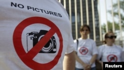 Demonstrators gather outside Georgia's presidential palace in Tbilisi in July 2011 to protest a notorious 2011 case in which the government used secret materials to accuse three Georgian journalists of spying for Russia.