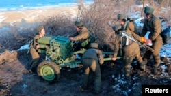 Female soldiers of the North's Korean People's Army take part in landing and defense drills on March 25.