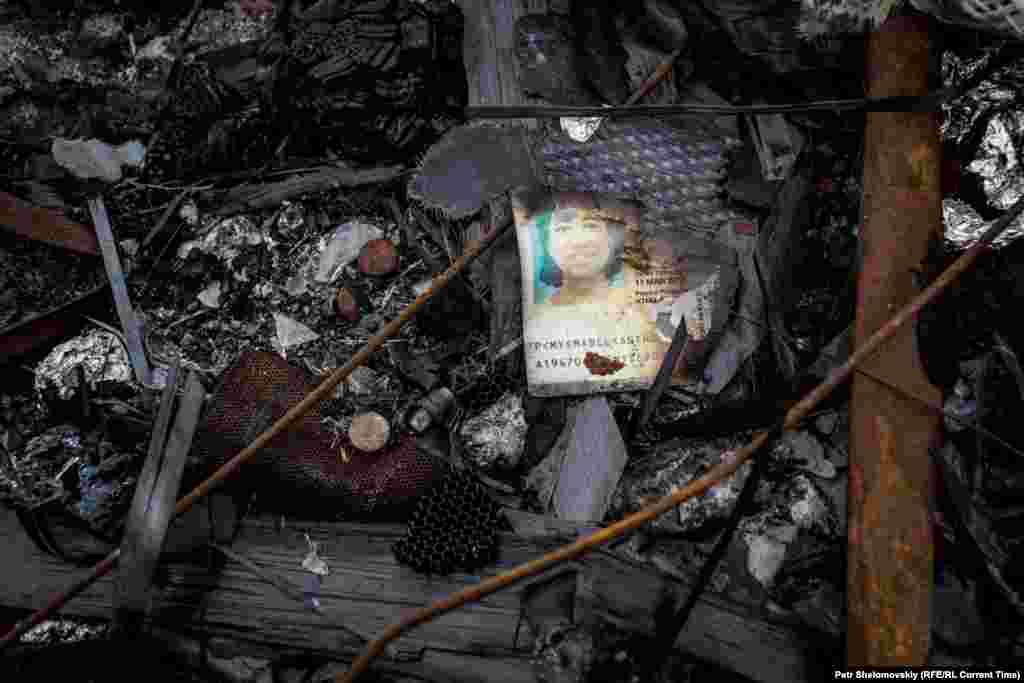 The charred passport of Mabel Anthonysamy Soosai from Malaysia is seen among the debris on April 1, 2015.