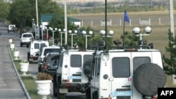 EU vehicles leave a base in the Georgian town of Mukhrani for cease-fire monitoring in October 2008, just two months after the brief Georgia-Russia conflict.