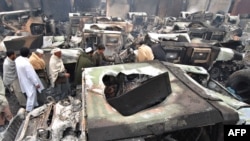 Burned-out trucks at a NATO terminal outside the Pakistani city of Peshawar