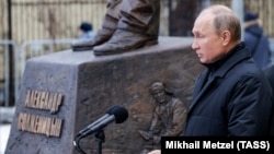 Russian President Vladimir Putin speaks during a ceremony to unveil a monument to Soviet-era dissident and writer Aleksandr Solzhenitsyn in Moscow.