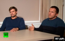 The two suspects -- Ruslan Boshirov (left) and Aleksandr Petrov, both of which may be aliases -- talk to RT.