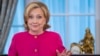 Former U.S. Secretary of State Hillary Clinton jokes with the audience during her speech at her portrait unveiling ceremony at the State Department in Washington on September 26.