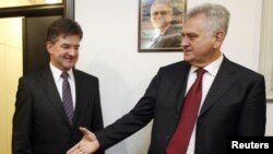 President-elect Tomislav Nikolic (right) greets Slovak Foreign Minister Miroslav Lajcak in Belgrade on May 24.