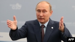 President Vladimir Putin gestures as he speaks at a meeting with G20 leaders St. Petersburg.