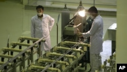 Technicians work at a new facility producing uranium fuel for a planned heavy-water nuclear reactor, just outside the city of Isfahan.