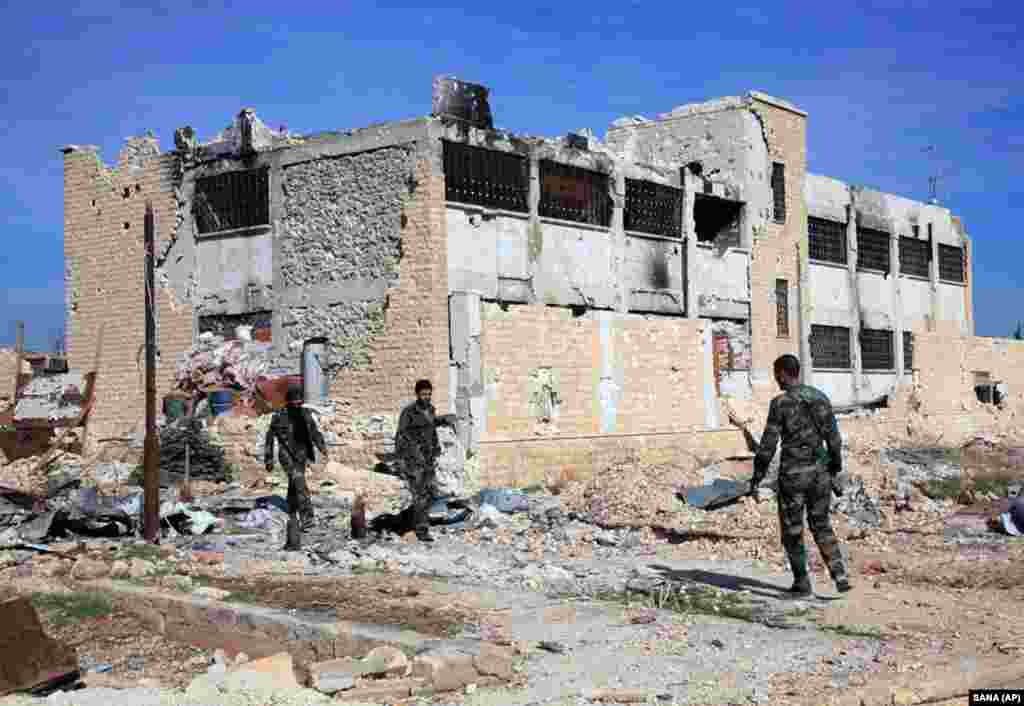 Following the outbreak of civil war in Syria in 2011, Soleimani ordered some of his Iraqi militias into Syria to support Syrian government troops, seen here at the Kweiras air base east of Aleppo. In November 2015, U.S. officials said some 2,000 Iranian or Iran-backed forces were participating in the regime&rsquo;s Aleppo operations.