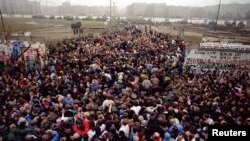 East Berliners and West Berliners after the fall of the Berlin Wall in 1989. Now, some Russian parliamentary deputies want to condemn the subsequenb reunification of Germany as an "annexation." 