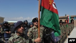 Afghan National Army soldiers stand in formation during a ceremony handing control of Bagram prison over to Afghan authorities. 