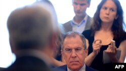 Russian Foreign Minister Sergei Lavrov (facing camera) meets Syrian National Council representatives at the Foreign Ministry in Moscow on July 11.