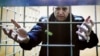 Aleksei Navalny gestures while speaking via a video link from prison during a court session on December 28. 